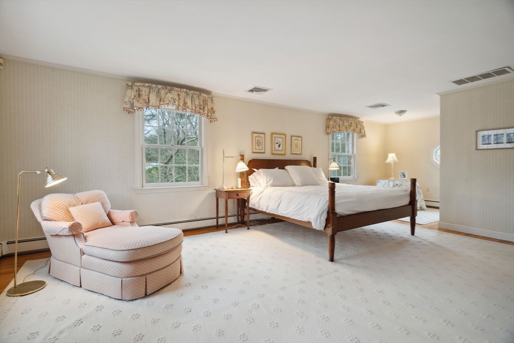 24 Wheeler Road Lincoln, MA 01773 - Photo 21 of 32 a bedroom with a bed and a couch