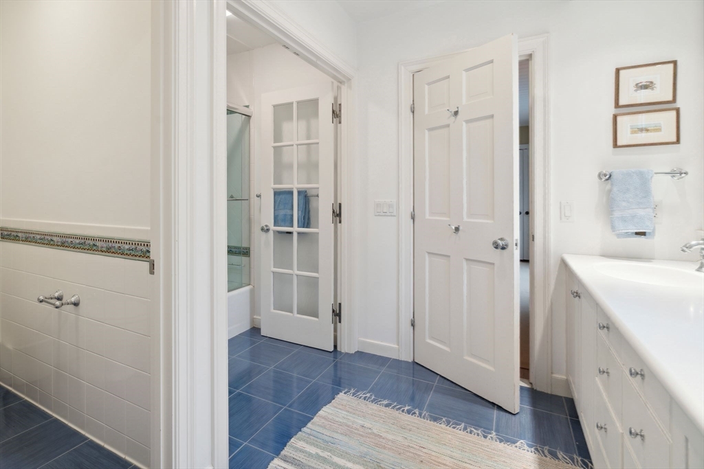 24 Wheeler Road Lincoln, MA 01773 - Photo 25 of 32 a view of a bathroom with a sink and a mirror