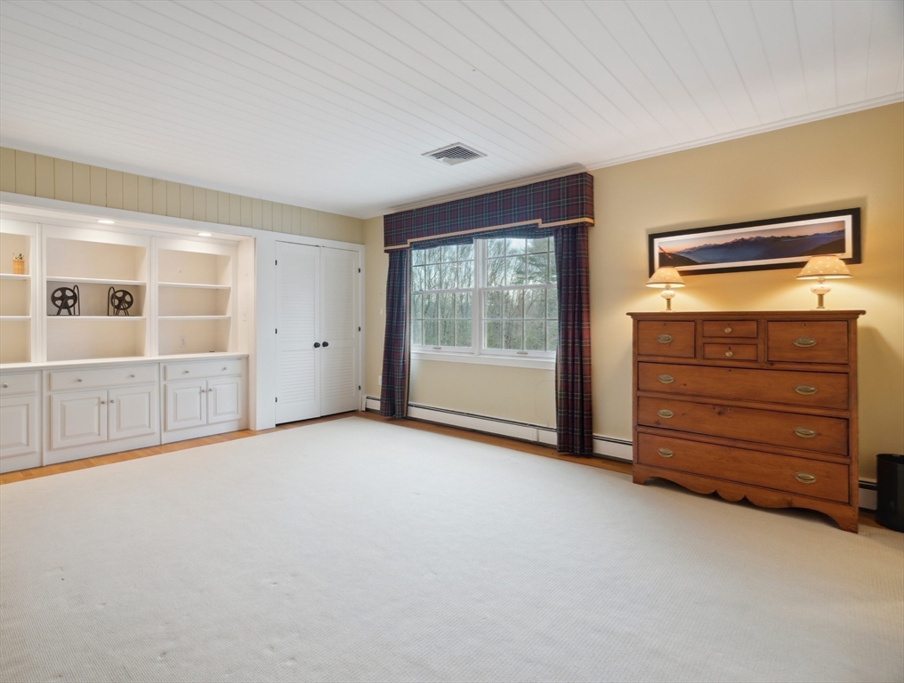 24 Wheeler Road Lincoln, MA 01773 - Photo 26 of 32 wooden floor in an empty room with a window