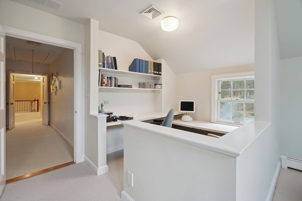 24 Wheeler Road Lincoln, MA 01773 - Photo 27 of 32 a kitchen with stainless steel appliances granite countertop a sink and a refrigerator