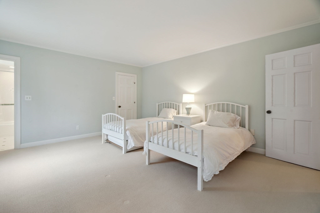 24 Wheeler Road Lincoln, MA 01773 - Photo 29 of 32 a bed room with two twin beds and a night stand