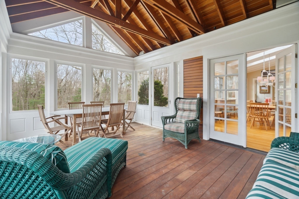 24 Wheeler Road Lincoln, MA 01773 - Photo 9 of 32 a view of a livingroom with furniture wooden floor and a large window