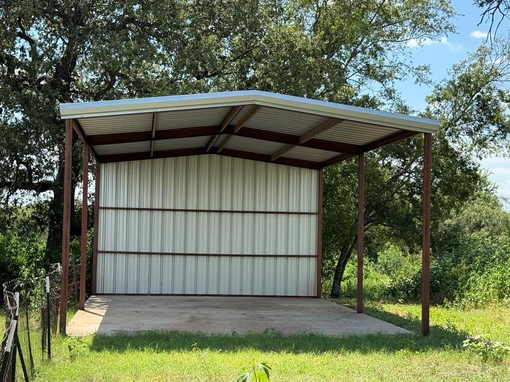 105a Riesel Tx 76682 Riesel, TX 76682 - Photo 12 of 34 a view of backyard with wooden fence and large trees