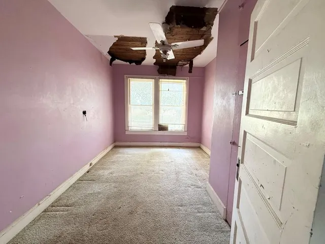 a kitchen with sink cabinets and white appliances