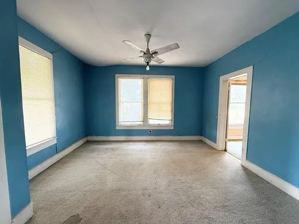 a view of a fountain in middle of the garden