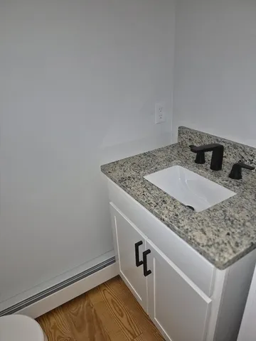 a bathroom with a sink and vanity