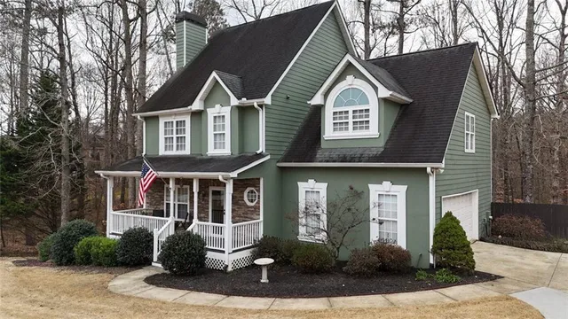 a view of a house with a yard and plants