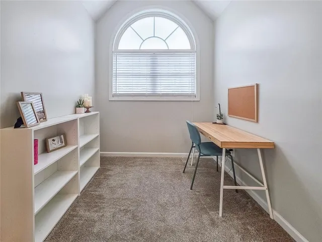 a living room with a window and a table