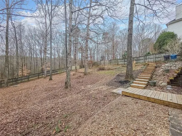 a backyard of a house with lots of green space