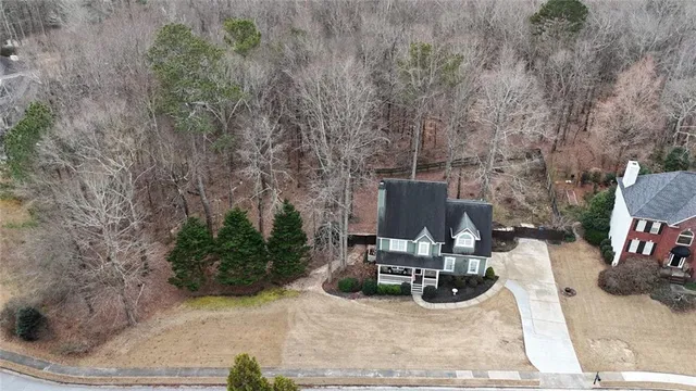 a view of a garden with wooden fence