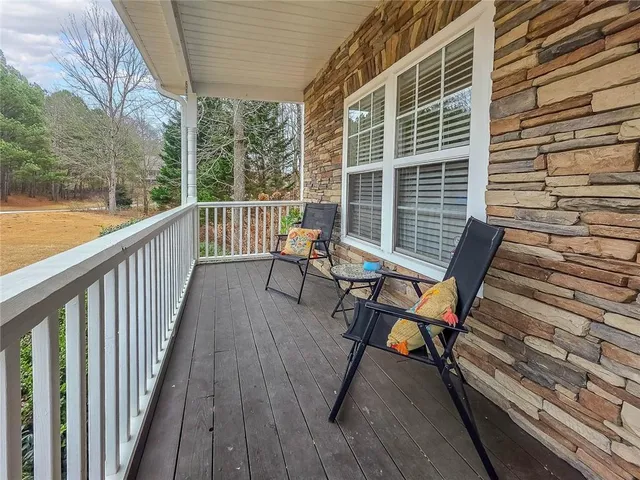 a view of a two chairs in the balcony