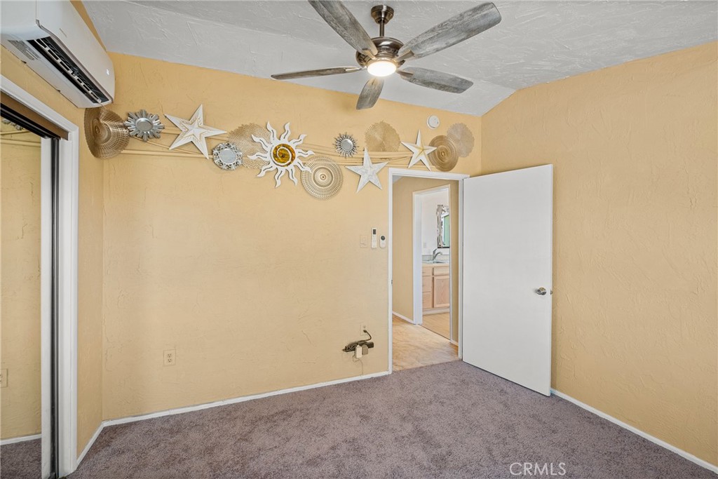 7787 Hidden Ranch Road Apple Valley, CA 92308 - Photo 20 of 36 an empty room with a fan