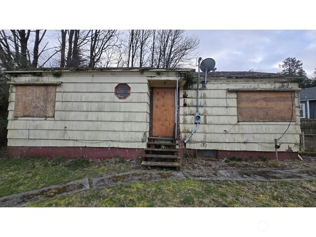 4010 22nd Avenue Southwest Seattle, WA 98106 - Photo 1 of 7 a front view of a house with a yard