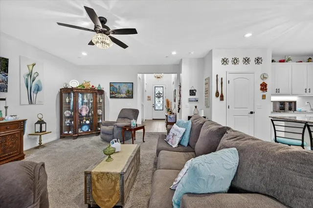 a bathroom with a granite countertop sink a toilet and a mirror