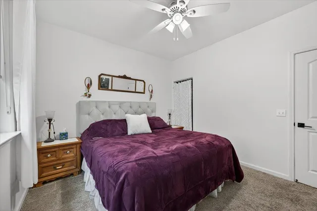 a bedroom with a bed and a television