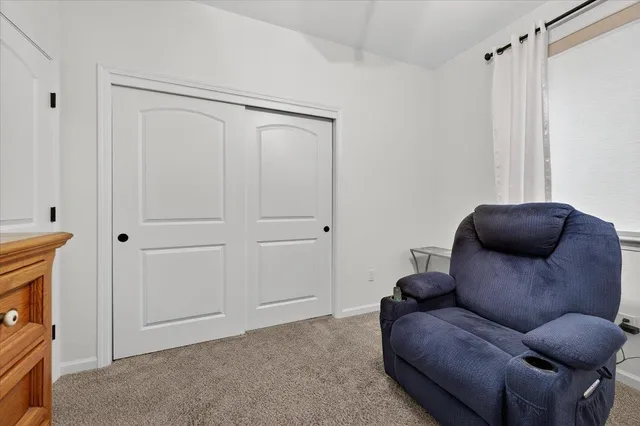 a spacious bathroom with a granite countertop sink mirror and shower