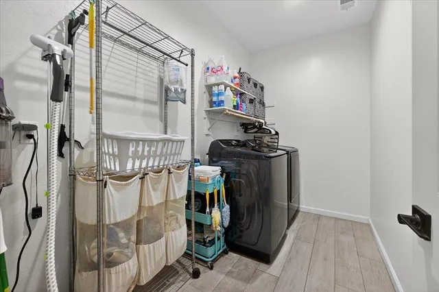 a bathroom with a granite countertop sink a toilet a mirror and shower