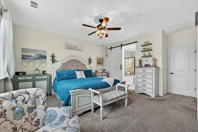 a view of a patio with a table and chairs under an umbrella