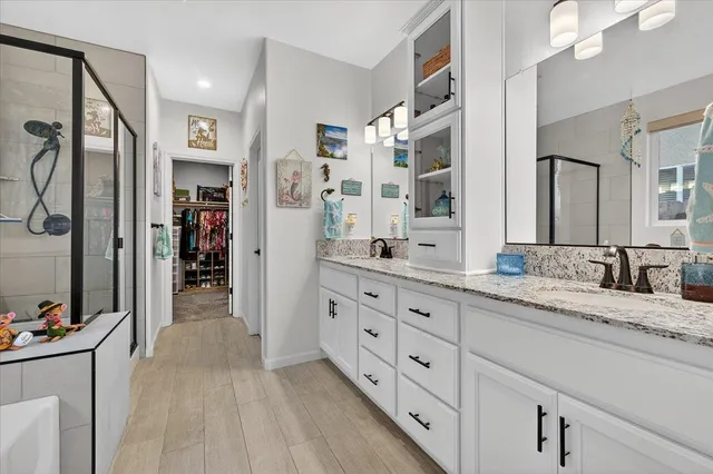 a view of a patio with a table and chairs under an umbrella