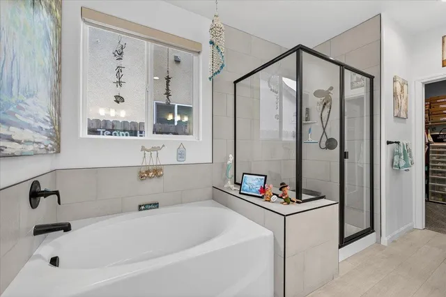 a view of a white house with a yard and table and chairs