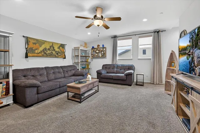 a front view of a house with a garden and plants