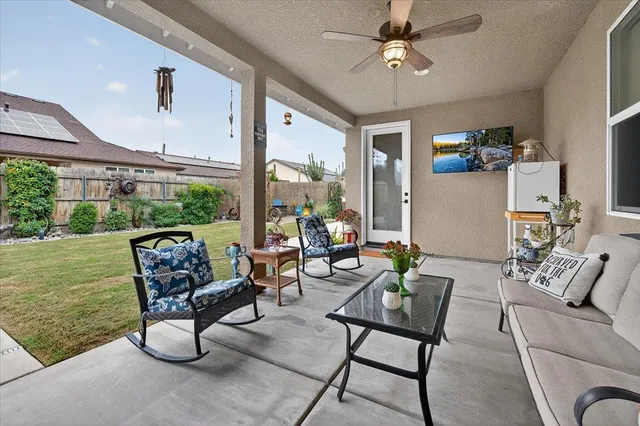 a front view of a house with a garden and yard