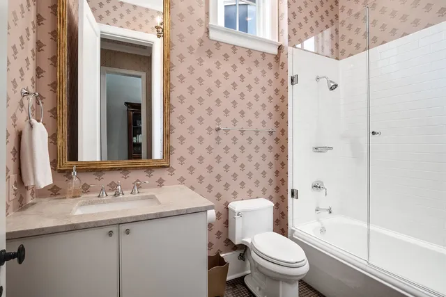 a spacious bedroom with a large bed and a walk in closet