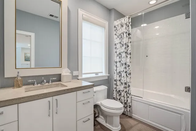 a room with gym equipment and windows