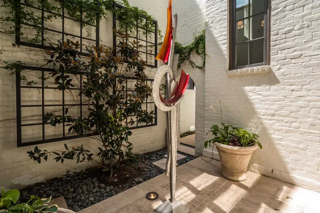 a view of house with outdoor space and sitting area