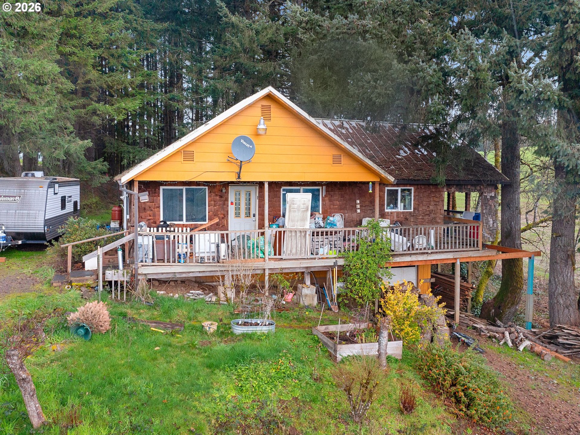 an aerial view of a house with swimming pool and porch
