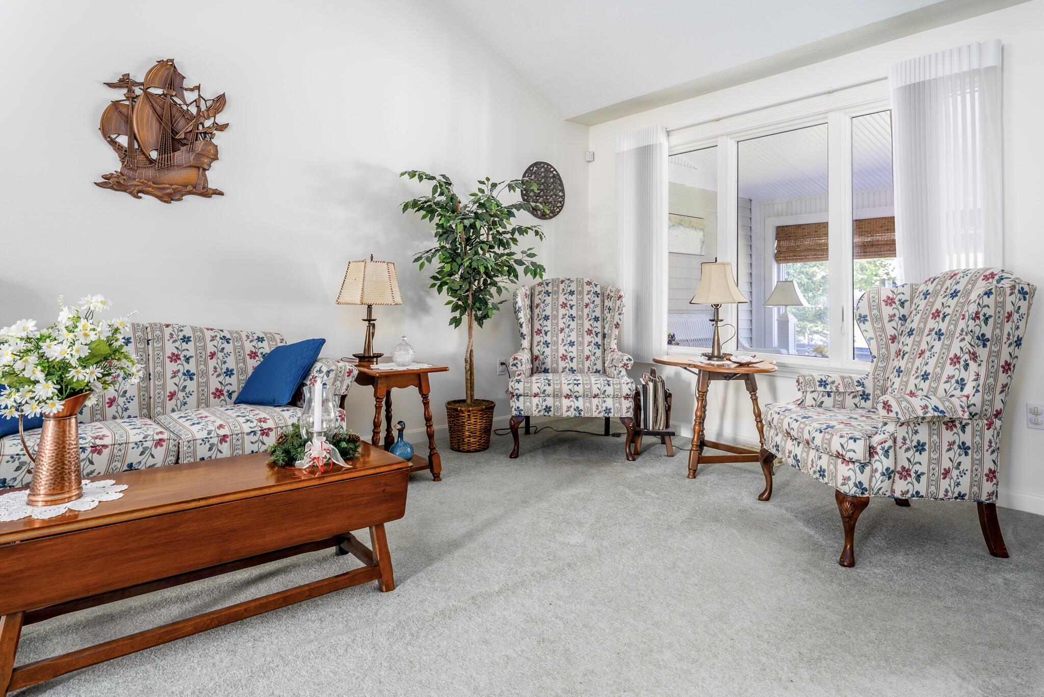 7 Masters Court Mashpee, MA 02649 - Photo 11 of 34 a living room with furniture and a potted plant