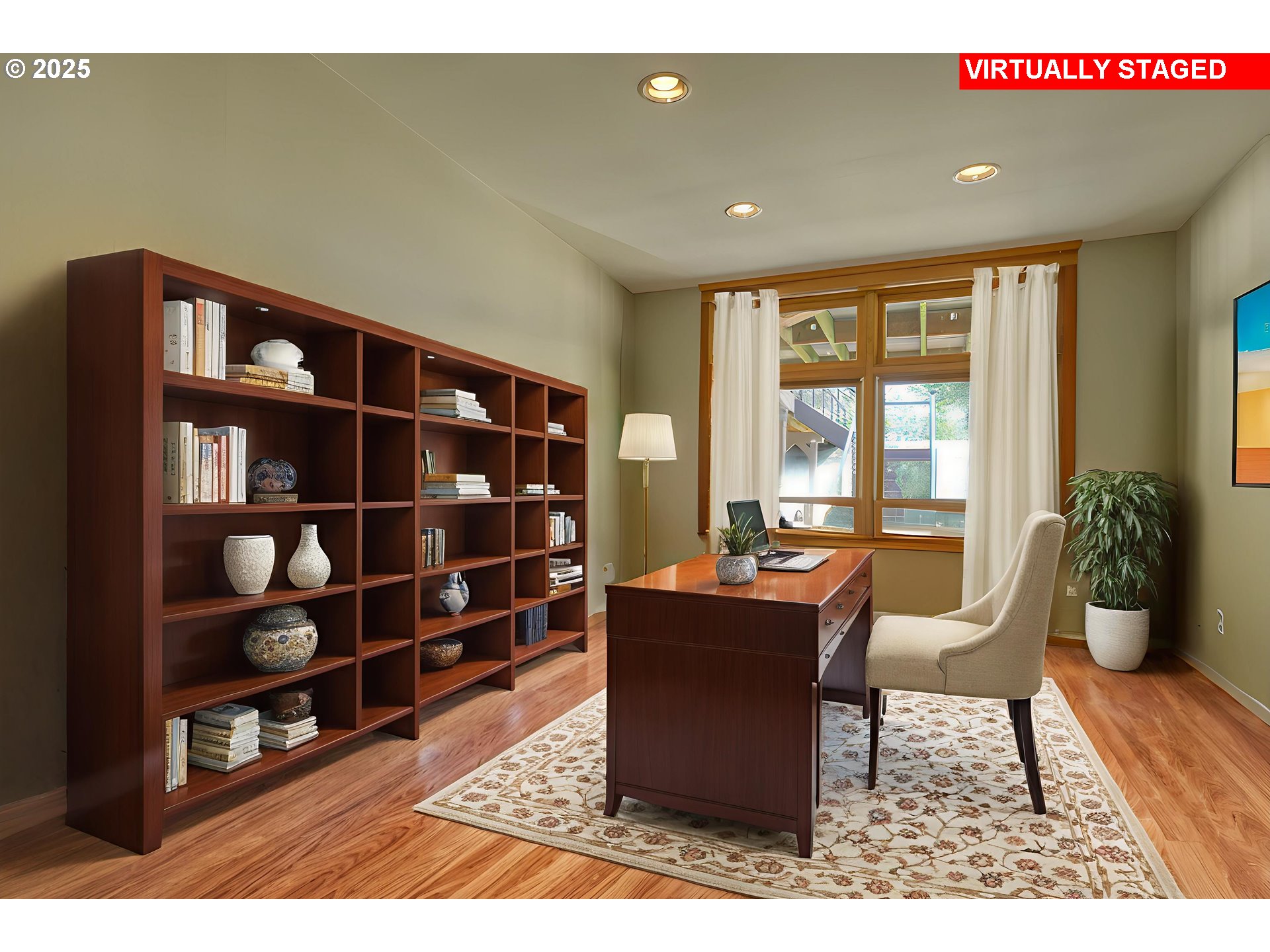 22732 Northwest Gillihan Road Portland, OR 97231 - Photo 11 of 48 a living room with furniture and a book shelf