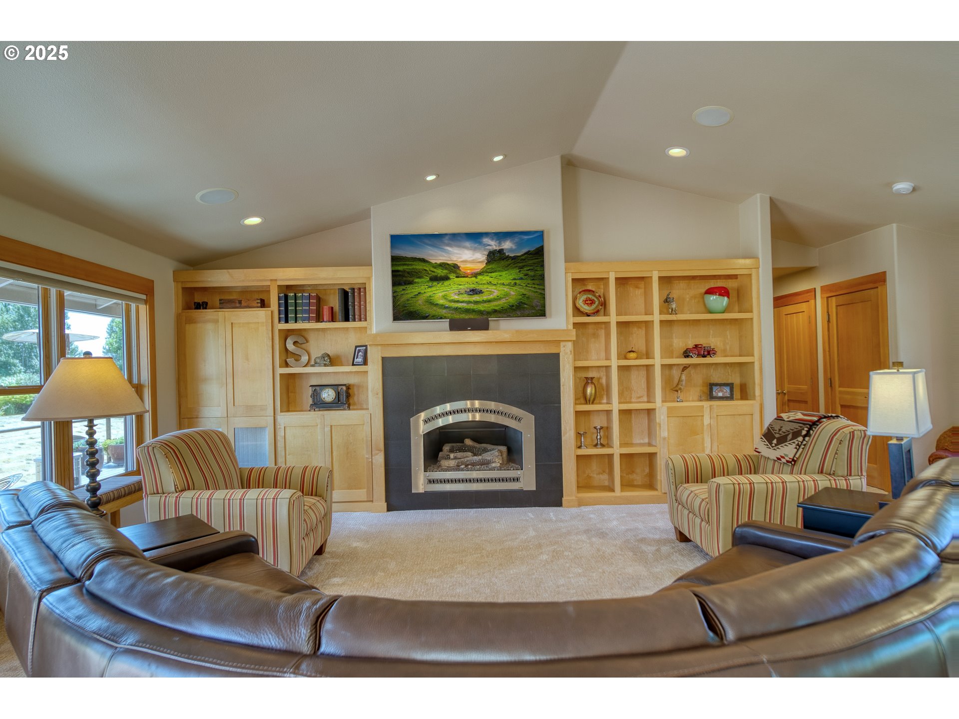 22732 Northwest Gillihan Road Portland, OR 97231 - Photo 15 of 48 a living room with furniture and a fireplace