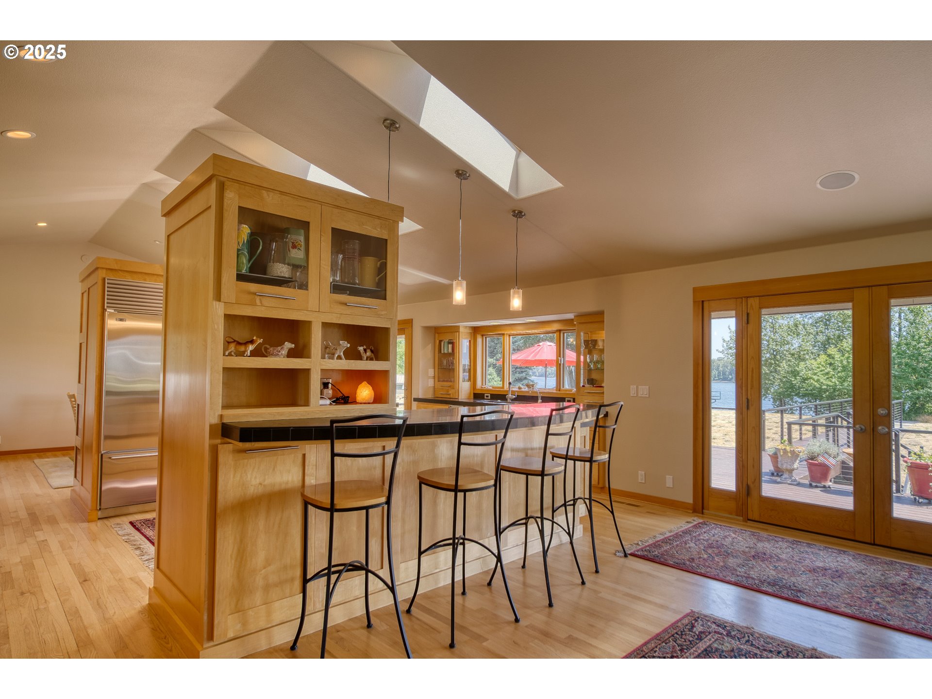22732 Northwest Gillihan Road Portland, OR 97231 - Photo 17 of 48 a dining room with furniture and wooden floor
