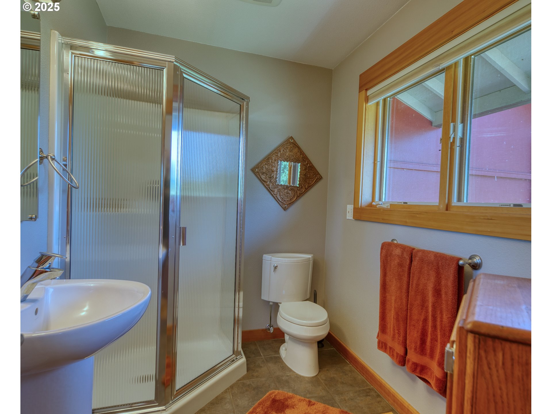 22732 Northwest Gillihan Road Portland, OR 97231 - Photo 19 of 48 a bathroom with a toilet sink and mirror