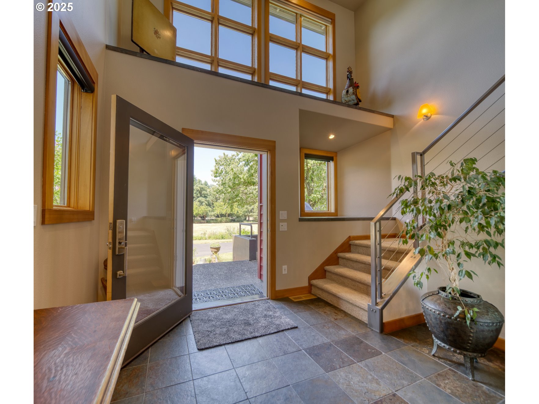 22732 Northwest Gillihan Road Portland, OR 97231 - Photo 4 of 48 a view of an entryway with a workspace