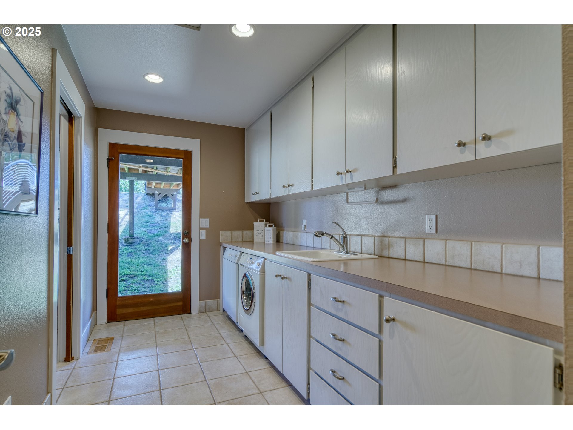 22732 Northwest Gillihan Road Portland, OR 97231 - Photo 8 of 48 a kitchen with a sink and cabinets