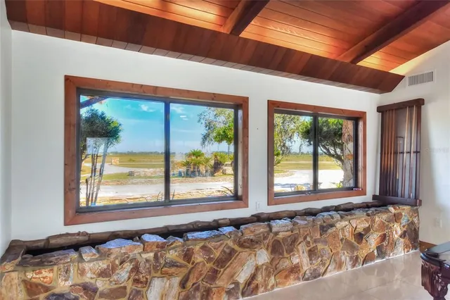 a view of a house with backyard porch and sitting area