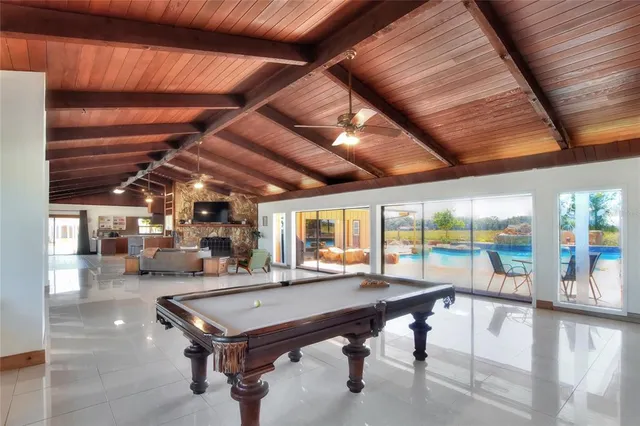 a view of a swimming pool with lounge chairs