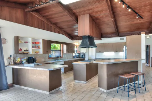 an aerial view of a house with outdoor space swimming pool and outdoor seating