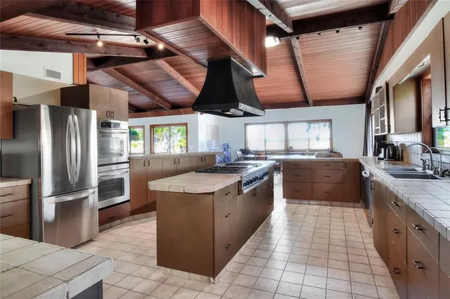 a view of empty room with wooden floor and a cabinet