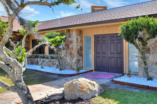 a living room with fireplace furniture and a flat screen tv