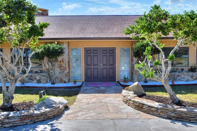 a view of a dining room with furniture and a window