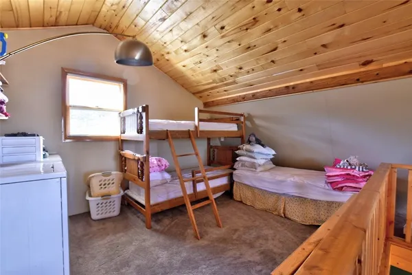 a bedroom with furniture and a bed