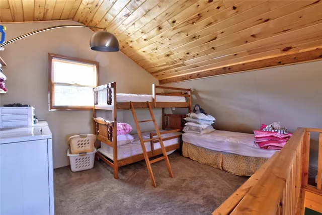 a bedroom with furniture and a bed