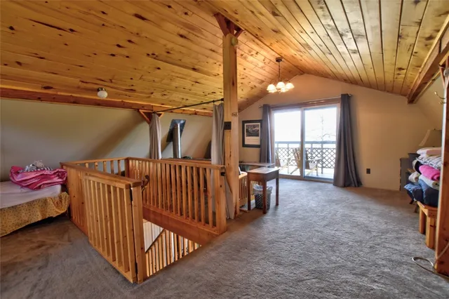 a view of a porch with furniture and front door