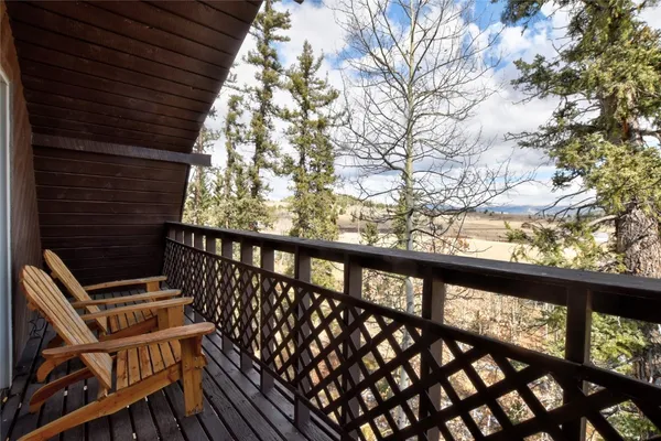 a view of balcony with wooden floor