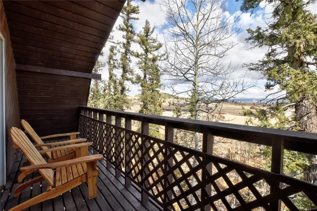a view of balcony with wooden floor