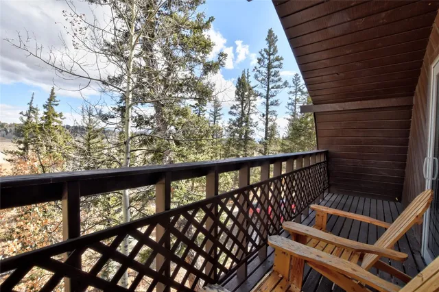 a view of balcony with wooden floor