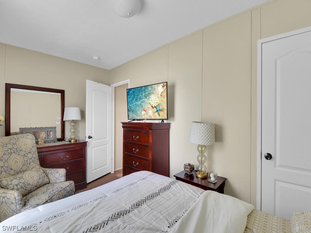 1183 Summerall Road LaBelle, FL 33935 - Photo 17 of 28 a bedroom with a bed and a dresser
